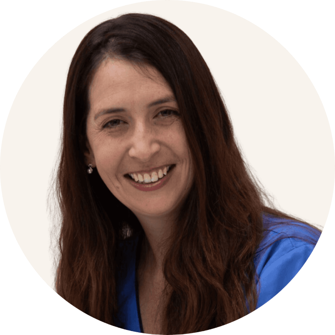 Rosanne Thurtell smiling, with long dark hair, wearing a blue top