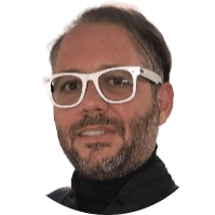 Gustavo Vieira, with a beard and white-framed glasses, wearing a black roll-neck