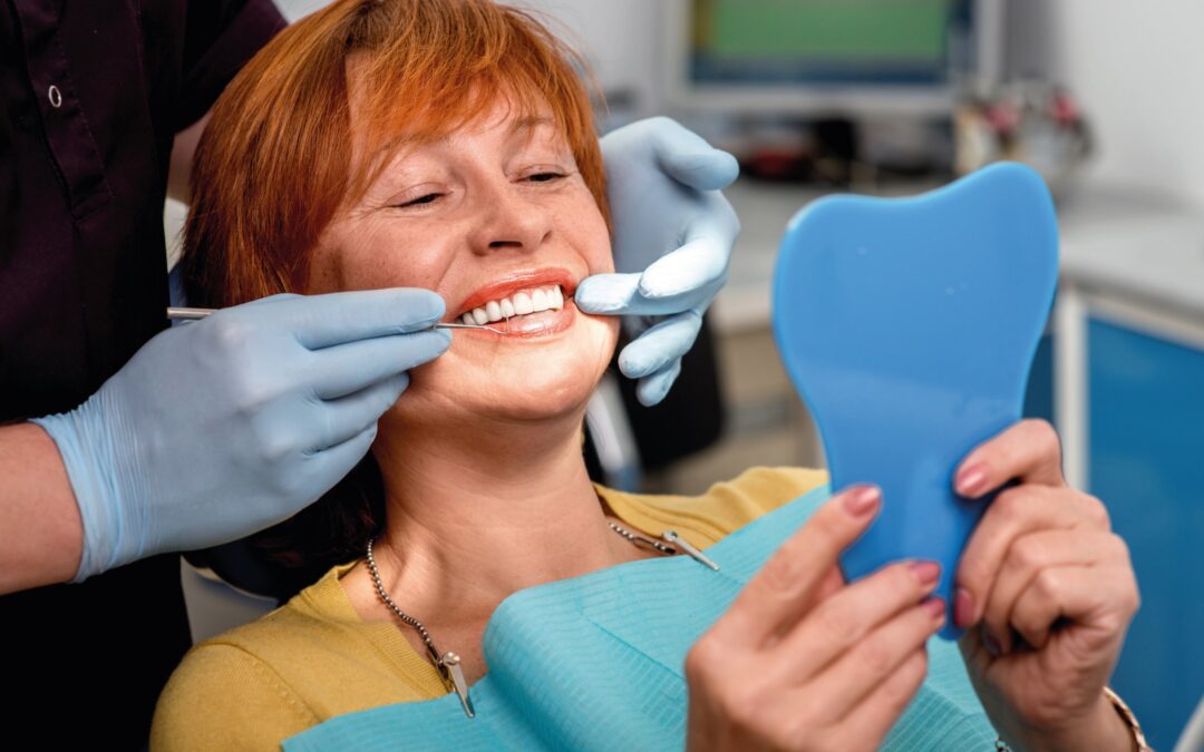 woman looking at her teeth